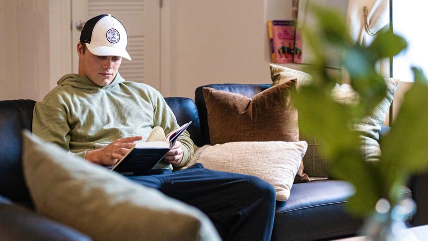 Student relaxing in modern apartment